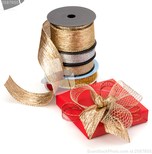 Image of Festive gift box and wrapping ribbons isolated on white backgrou