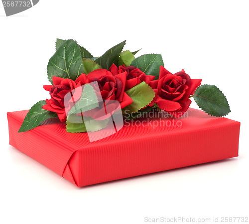 Image of Gift with floral decor. Flowers are artificial. 