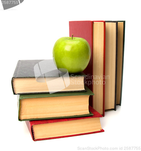 Image of book stack with apple isolated on white background 