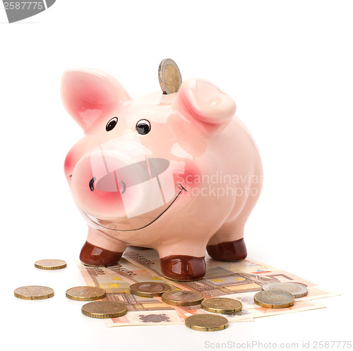 Image of Business concept. Lucky piggy bank isolated on white background.