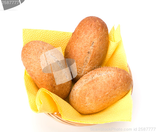 Image of fresh warm rolls in breadbasket isolated on white background