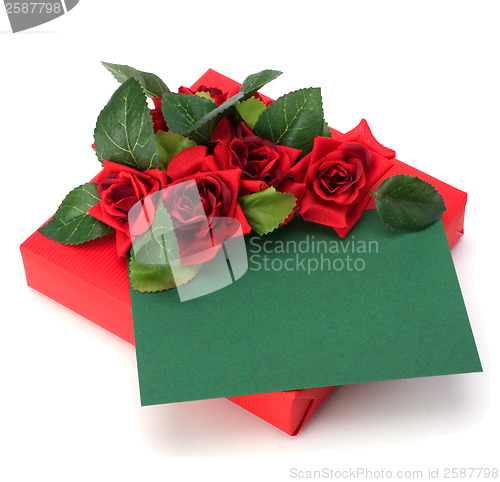 Image of Gift with floral decor. Flowers are artificial. 