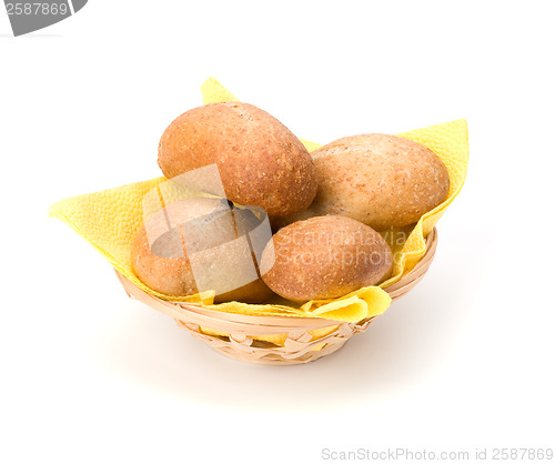 Image of fresh warm rolls in breadbasket isolated on white background