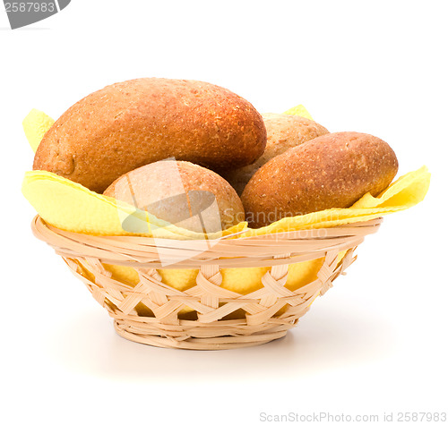 Image of fresh warm rolls in breadbasket isolated on white background