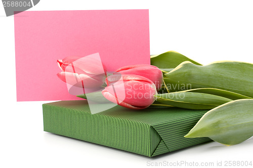 Image of gift with pink tulips  isolated on white background