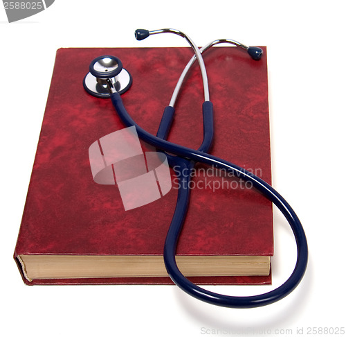 Image of stethoscope on red book isolated on white background