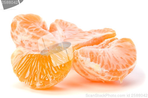 Image of peeled mandarin segments isolated on white background