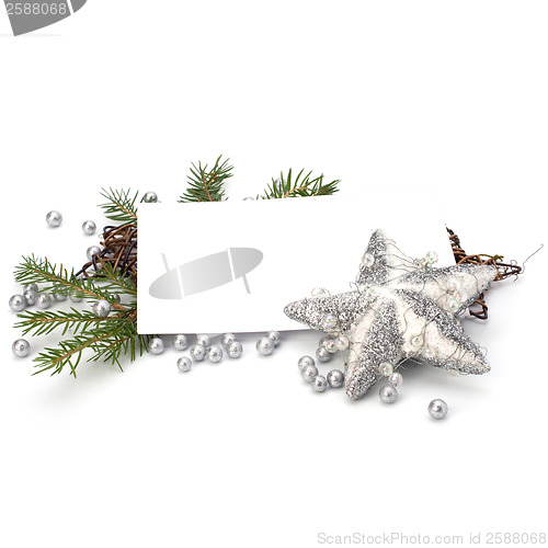 Image of Christmas decoration with greeting card isolated on white backgr