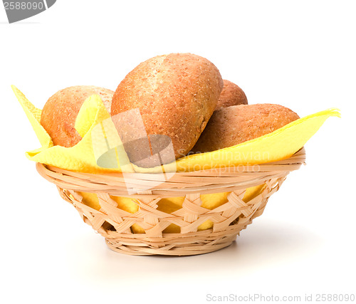 Image of fresh warm rolls in breadbasket isolated on white background