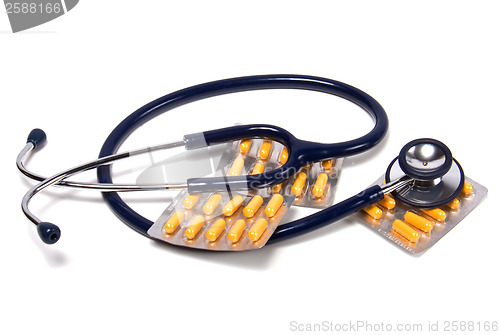 Image of stethoscope and tablets isolated on white background