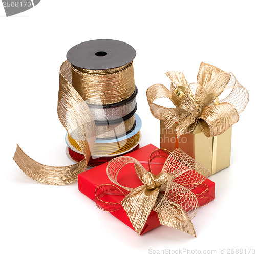 Image of Festive gift box and wrapping ribbons isolated on white backgrou