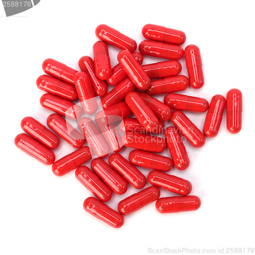 Image of red capsules isolated on white background