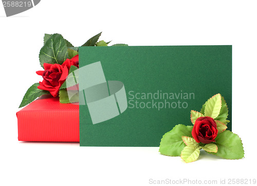 Image of Gift with floral decor. Flowers are artificial. 