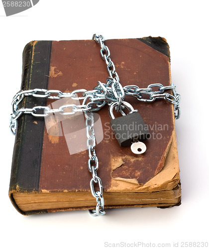 Image of tattered book with chain and padlock isolated on white backgroun