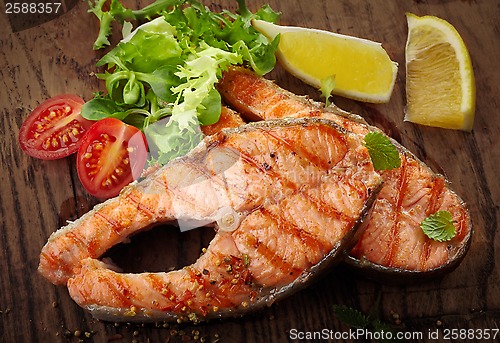 Image of grilled salmon steak slices