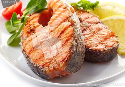 Image of fresh grilled salmon steak slices
