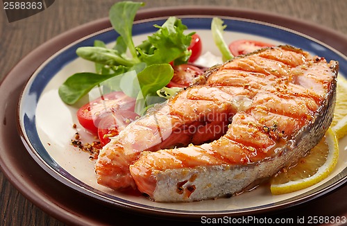 Image of fresh grilled salmon steak slice