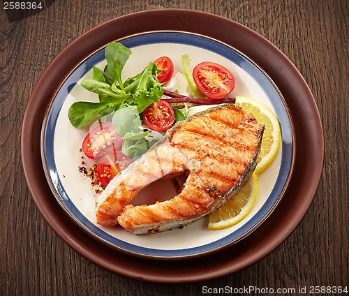 Image of fresh grilled salmon steak slice