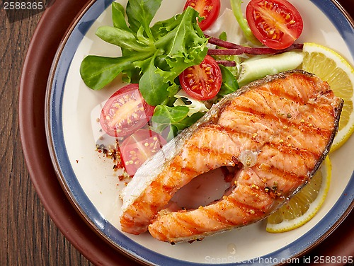 Image of fresh grilled salmon steak slice