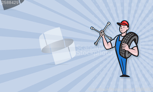 Image of Mechanic With Tire Socket Wrench And Tire
