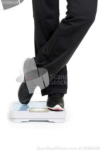 Image of Female feet on scales