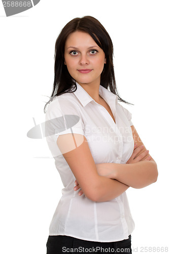 Image of Young beautiful brunette girl in a white blouse