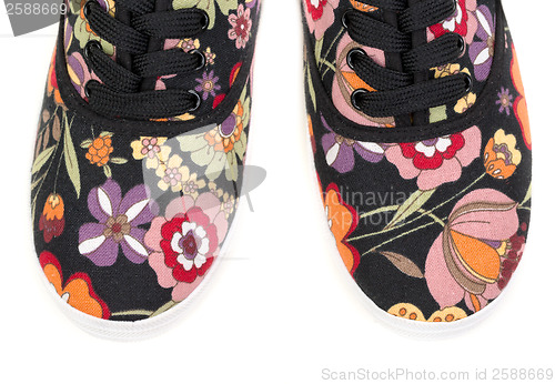 Image of black sneakers with floral pattern i