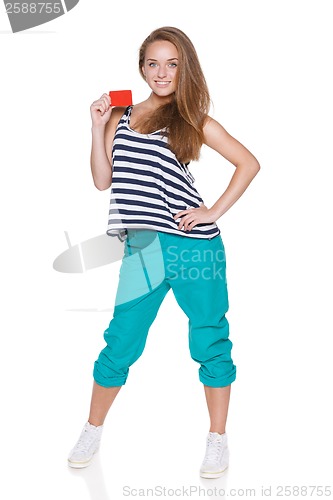 Image of Positive teen girl smiling showing credit card