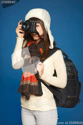 Image of Winter woman  traveler with photocamera