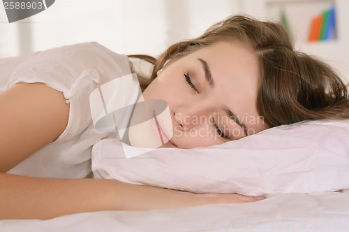 Image of Girl lying in bed