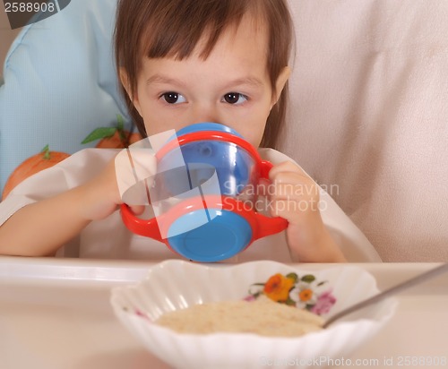 Image of Little girl eating