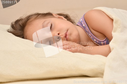 Image of Little girl in bed