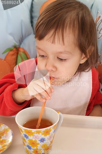 Image of Little girl eating