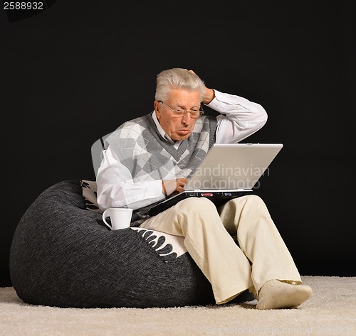 Image of Elderly man with laptop