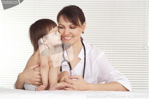 Image of Pediatrician doctor with little girl