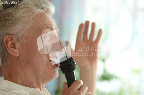 Image of Senior man singing