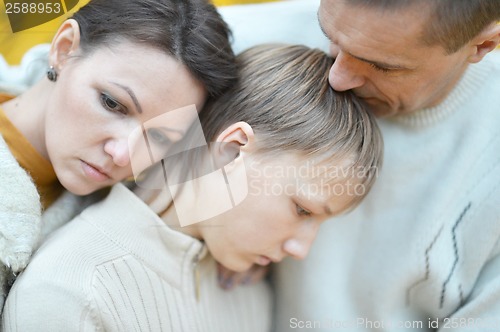 Image of Sad family of three on the nature