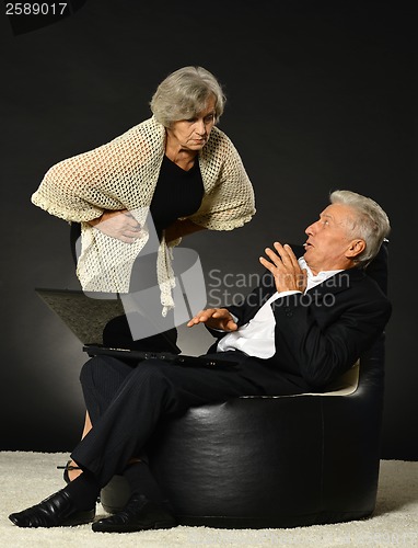 Image of Elderly couple using laptop