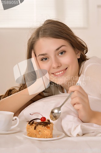 Image of Young Caucasian woman lying in bed