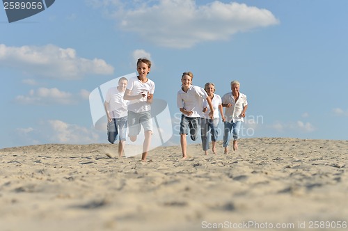 Image of happy family running