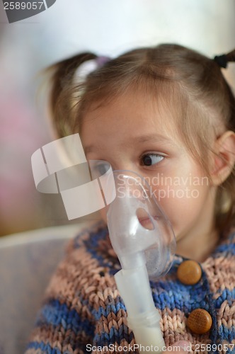 Image of Little girl with inhaler