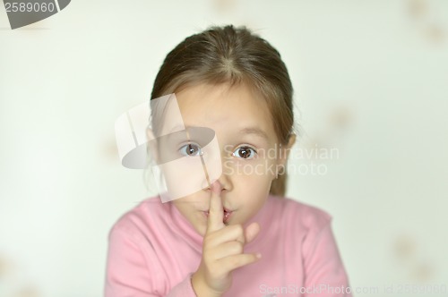 Image of Portrait of emotional little girl at home