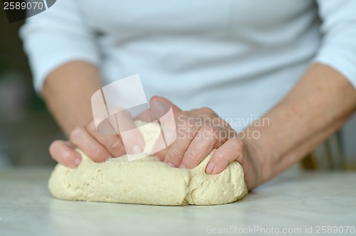 Image of Woman making dough
