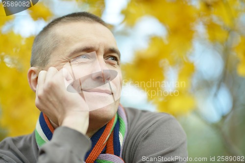 Image of Attractive man in autumn