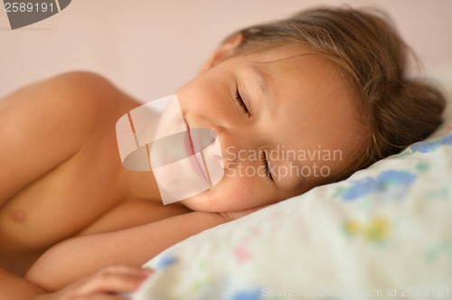 Image of Little girl in bed