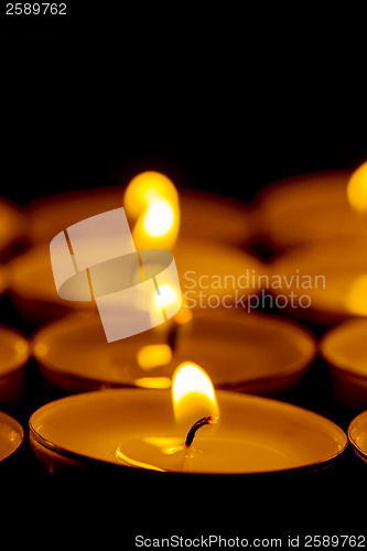 Image of Tea lights candles with fire