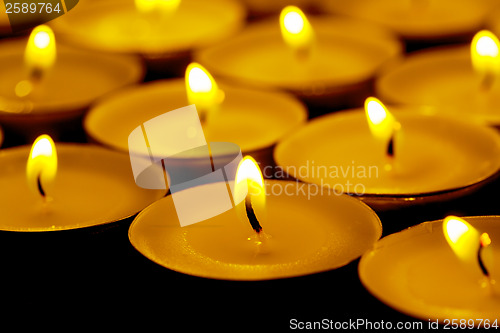 Image of Tea lights candles with fire
