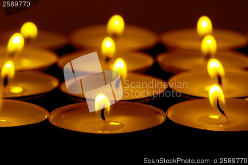 Image of Tea lights candles with fire