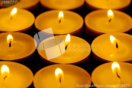 Image of Tea lights candles with fire