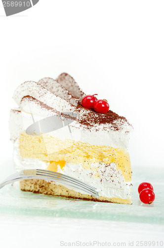 Image of whipped cream and ribes dessert cake slice